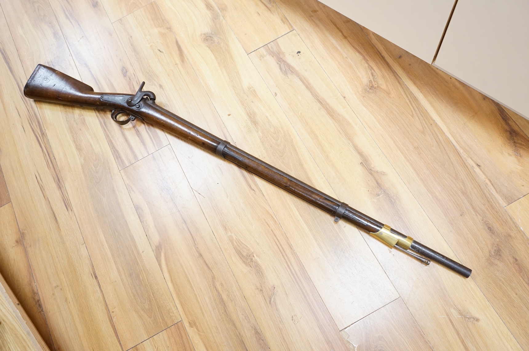 A 12 bore single barrel, back action, continental military percussion musket, barrel 93cm, possibly Russian, with regulation iron mounts and brass fore cap dated 1838